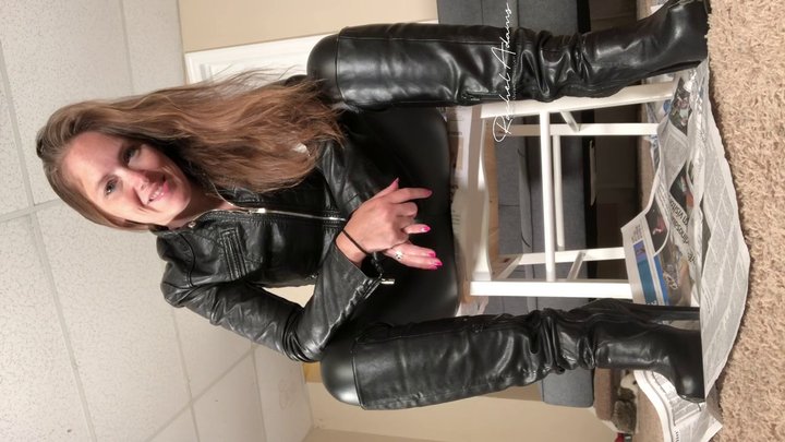 leather clad mistress has you bound at her feet vertical video